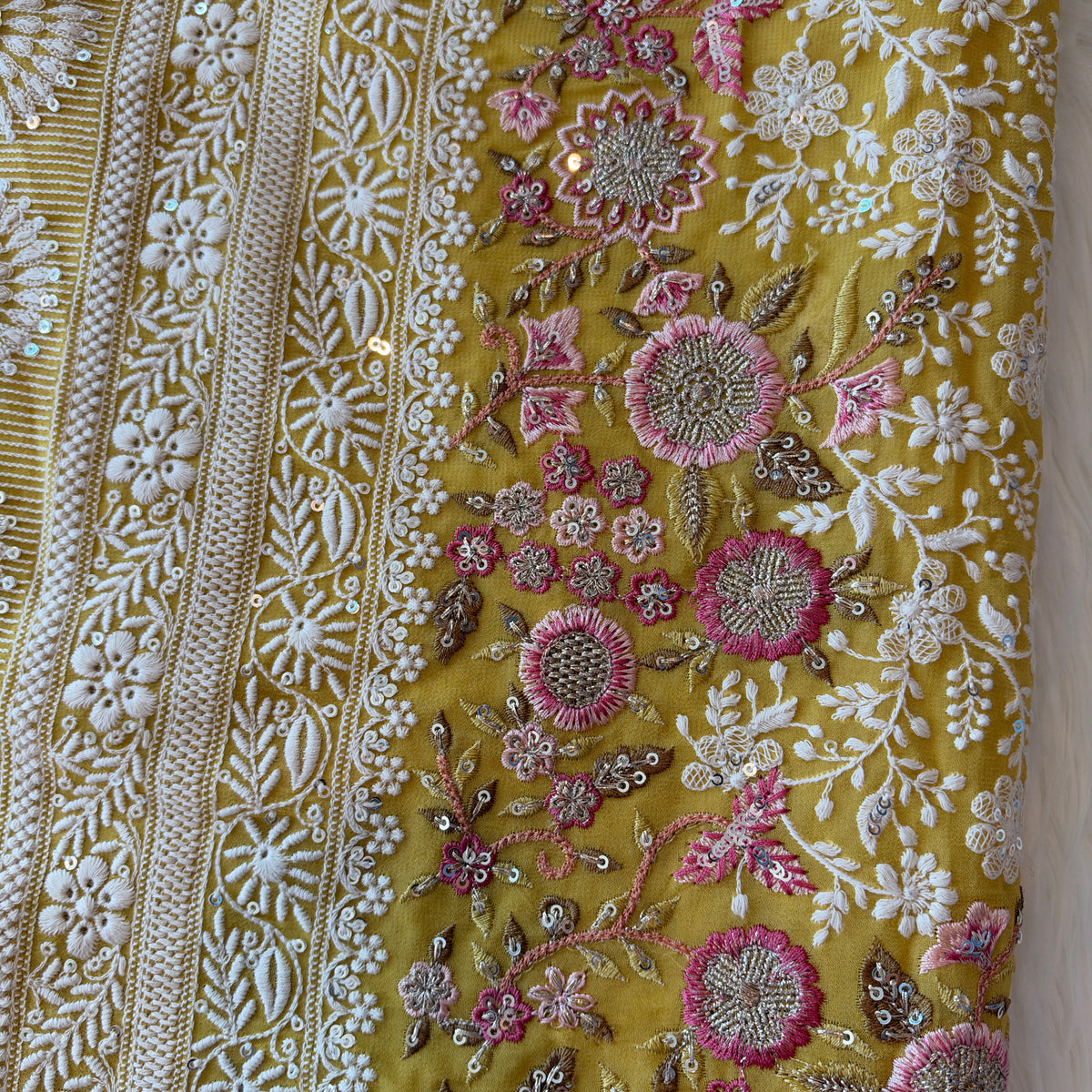Handcrafted Chikankari Premium Georgette Saree with Multicolored Floral Embroidery & Pallu Tassels