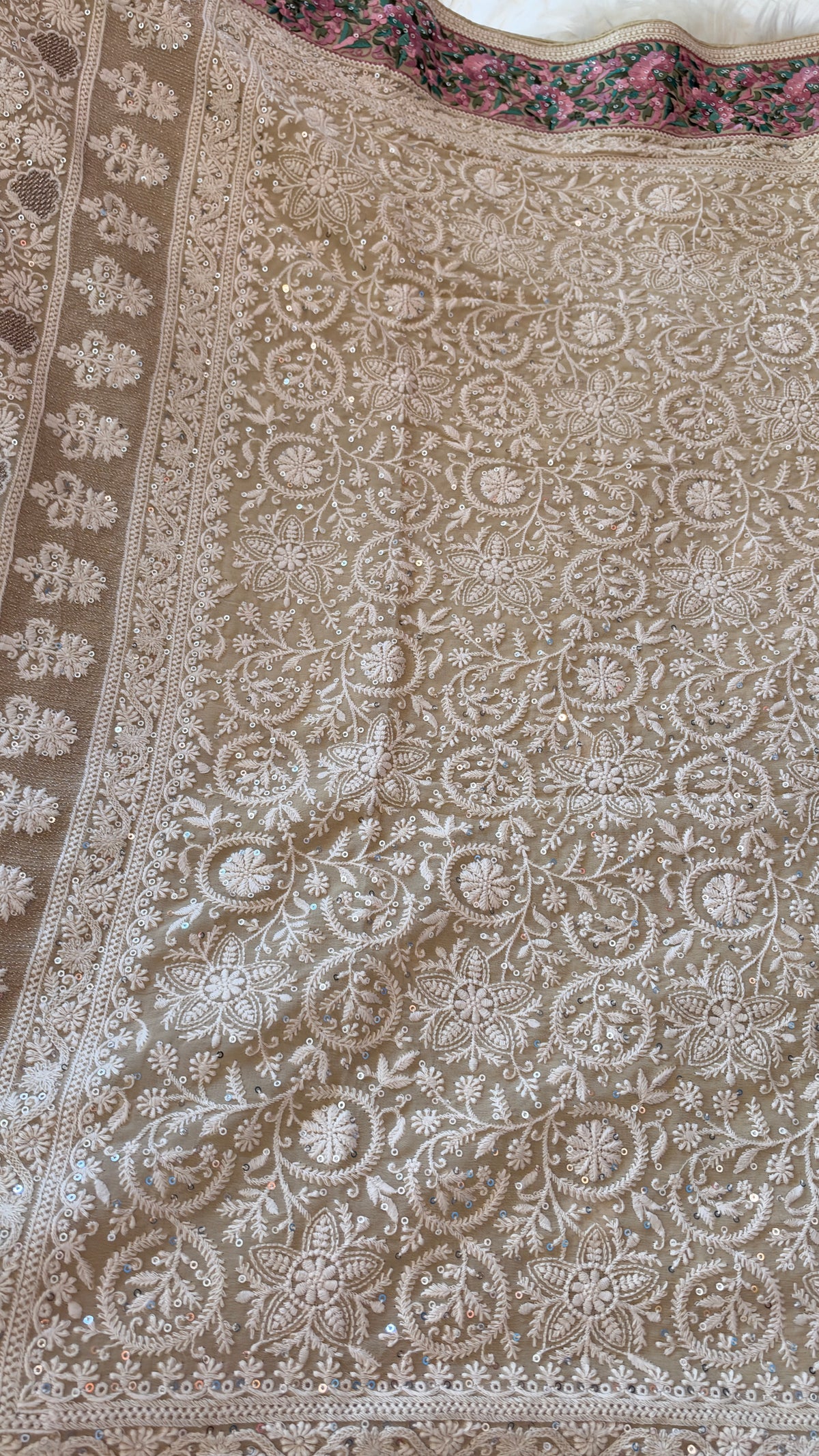 Regal Chikankari Georgette Saree with Ornate Pastel Floral Border & Handcrafted Tassels