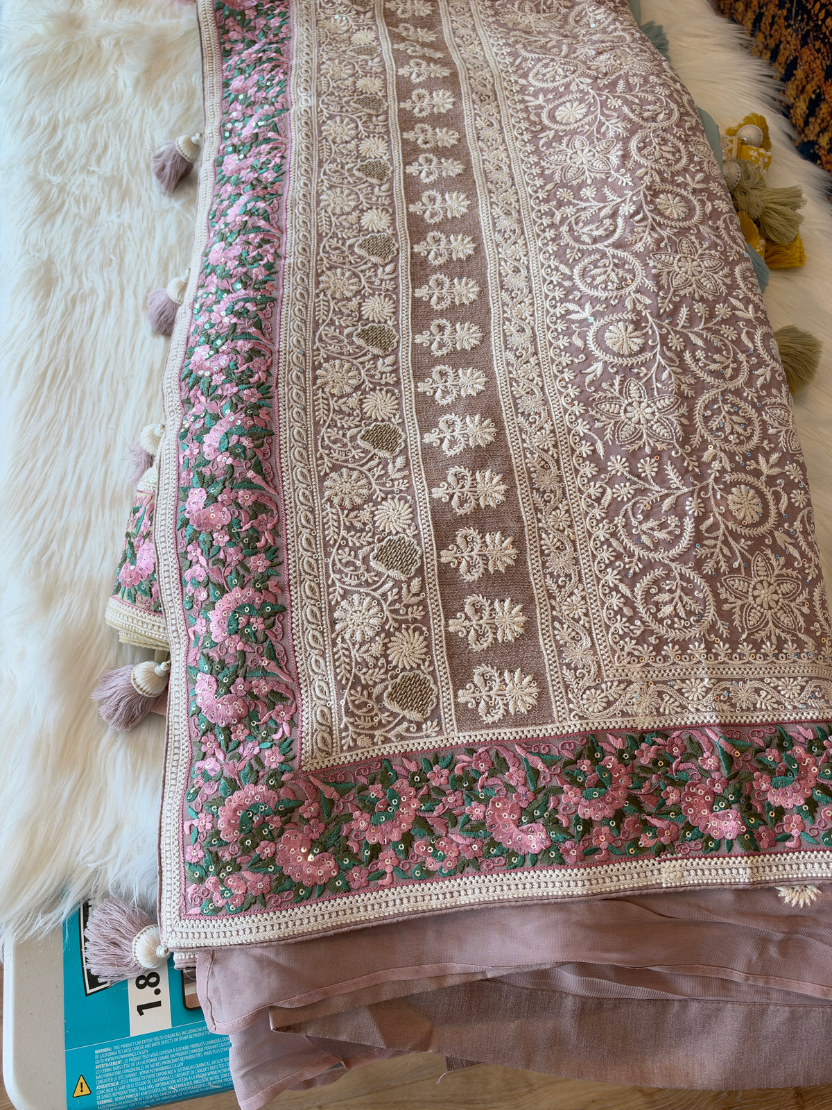 Regal Chikankari Georgette Saree with Ornate Pastel Floral Border & Handcrafted Tassels
