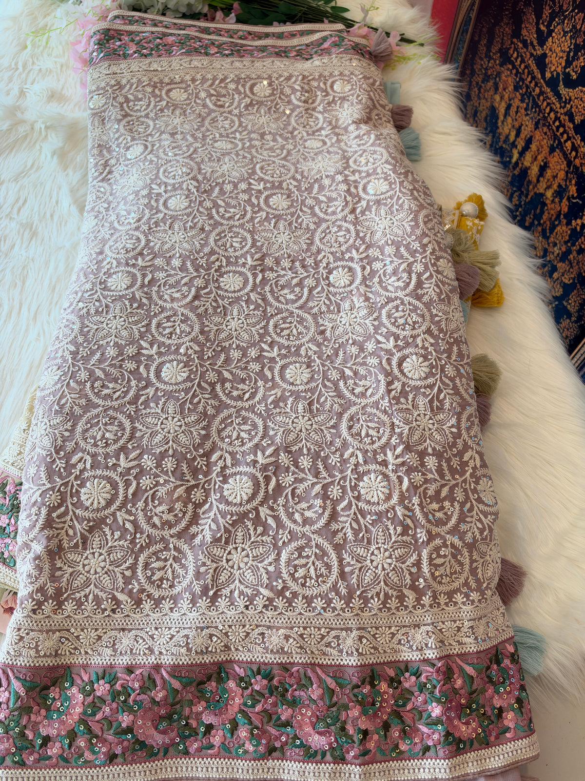Regal Chikankari Georgette Saree with Ornate Pastel Floral Border & Handcrafted Tassels