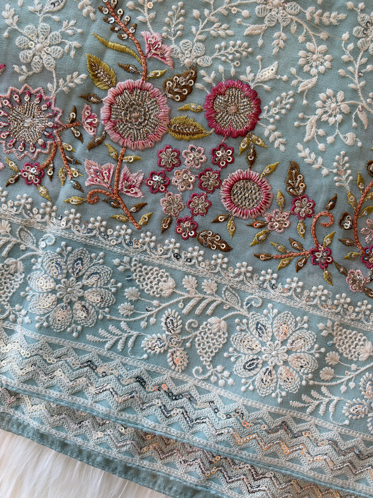 Handcrafted Chikankari Premium Georgette Saree with Multicolored Floral Embroidery & Pallu Tassels