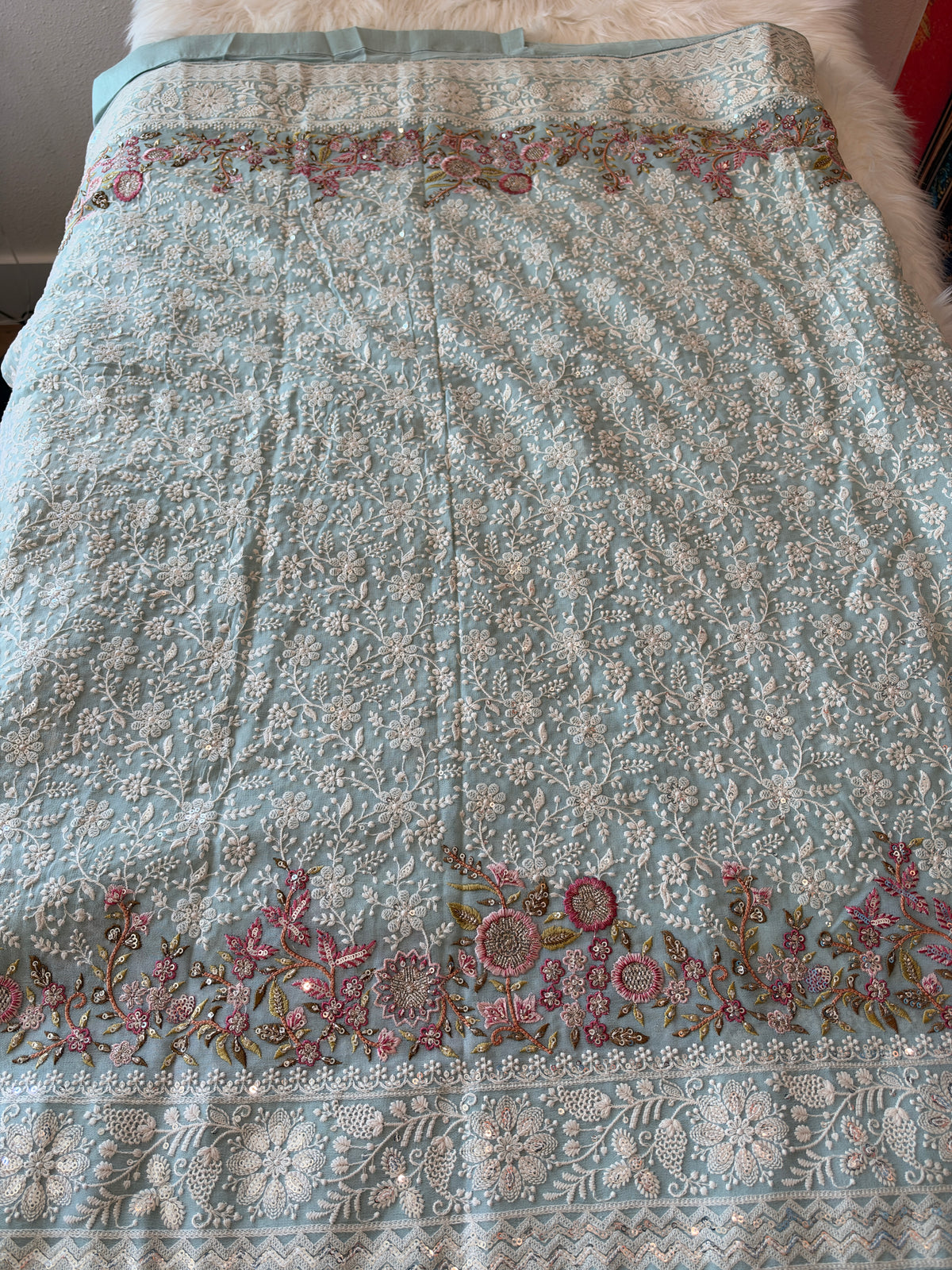 Handcrafted Chikankari Premium Georgette Saree with Multicolored Floral Embroidery & Pallu Tassels